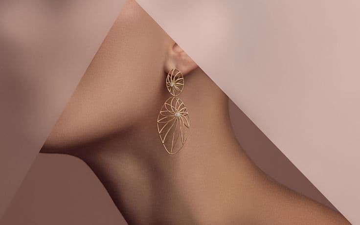 Gold statement earring — editorial close-up for the full collection